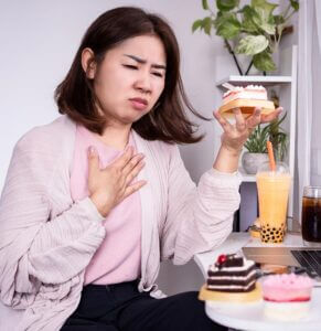 Woman suffering from acid reflux issues