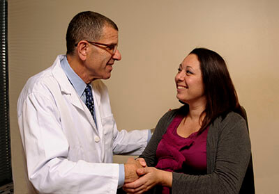 Alan E. Oshinsky with patient